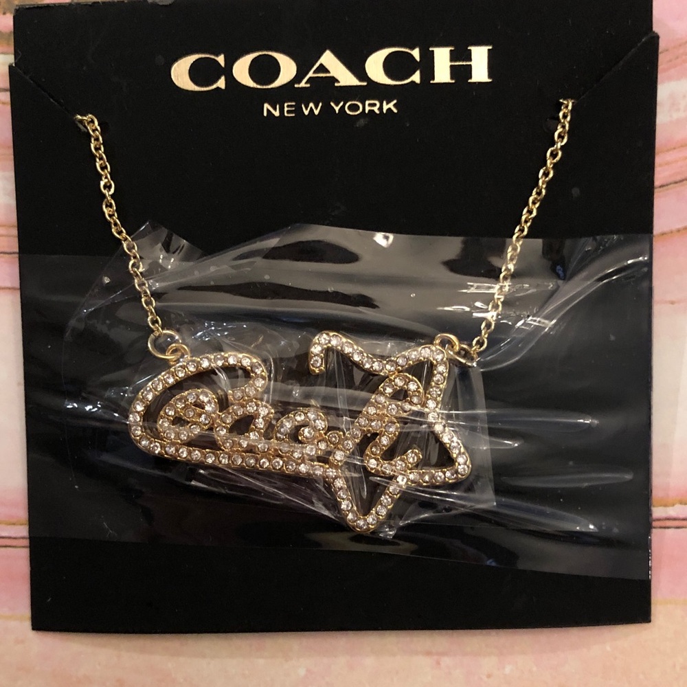 Authentic New with tag Coach Gold-Tone Script Logo Necklace with Clear Crystals